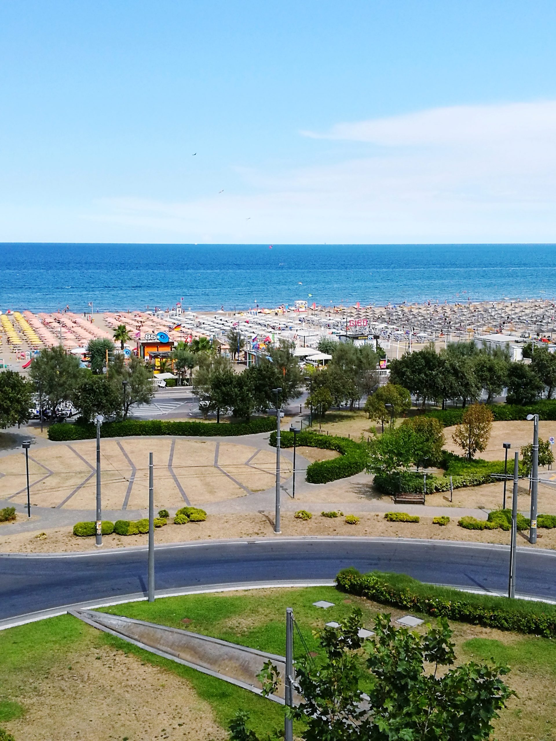 high-angle-view-trees-by-sea-against-clear-sky